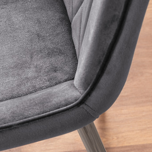 A close up of velvet dining chair material