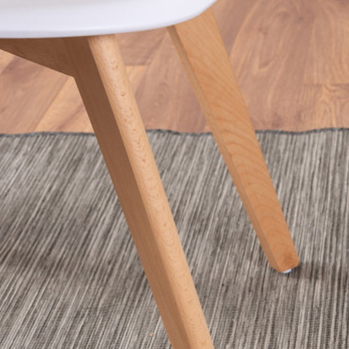 A wooden dining chair leg