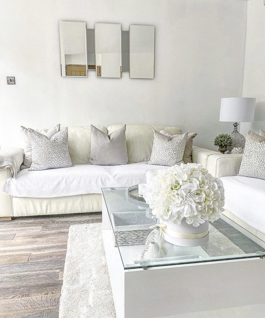 A beautifully decorated living room in white and cream colours