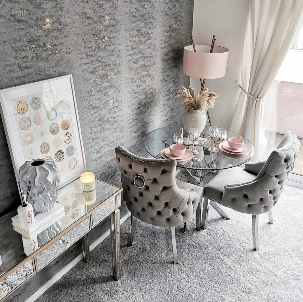 A pink and grey themed dining area