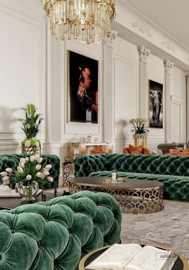 A grand seating area decorated with green and gold