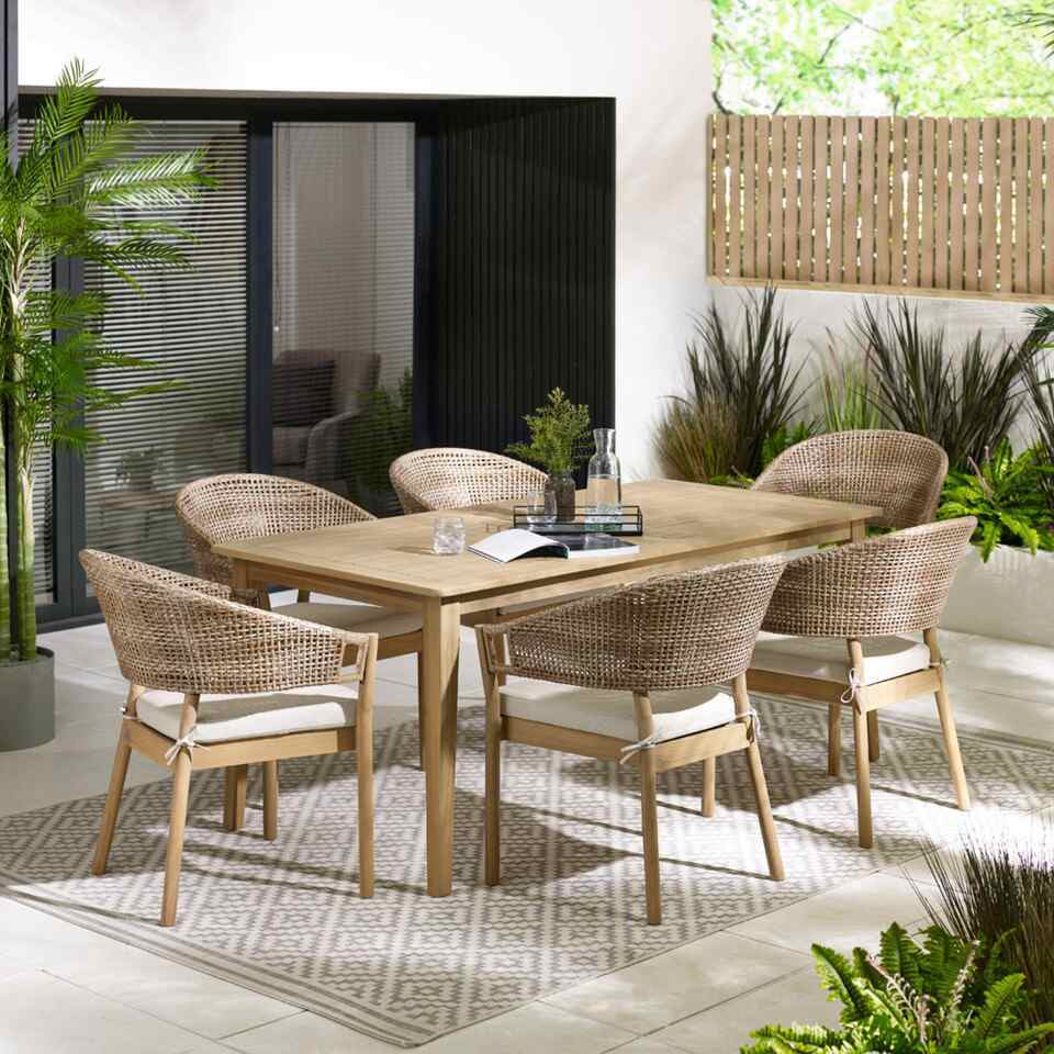 rectangular wood garden dining table with 6 wicker and wood dining chairs