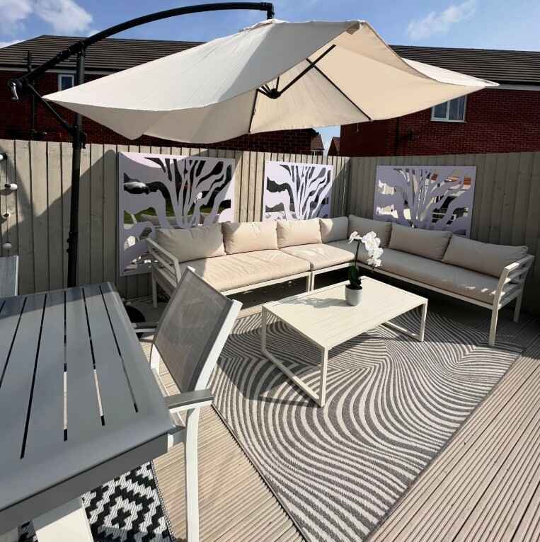 white metal garden sofa and grey-white outdoor table