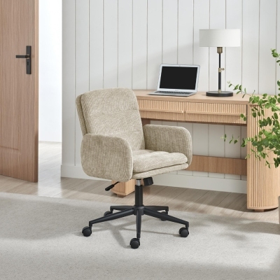 beige fabric swivel office chair in front of slimline wood oak desk with laptop and lamp