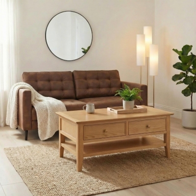 wooden coffee table in front of tan leather sofa on jute rug for a quiet luxury living room