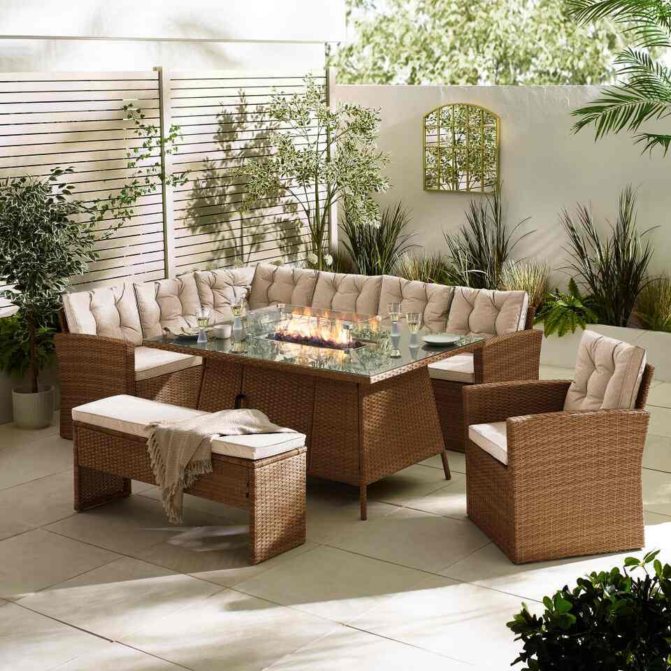 brown rattan garden dining set with tabletop firepit