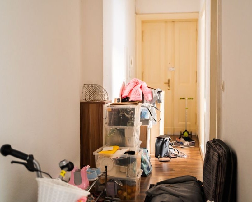 a cluttered hallway full of storage boxes