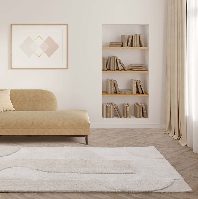 bright modern living room with sofa, and cream rug on floor with arched design carved into rug