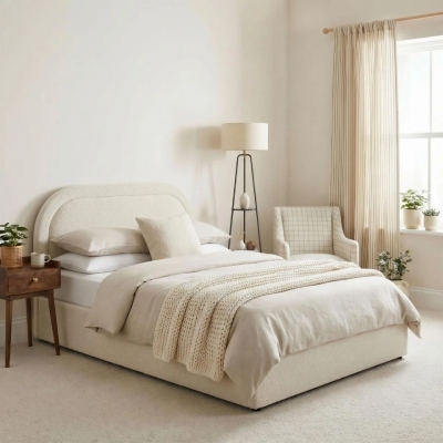 luxury teen bedroom with double bed in cream boucle fabric, in cosy neutral room with wooden bedside table, standing lamp and large window