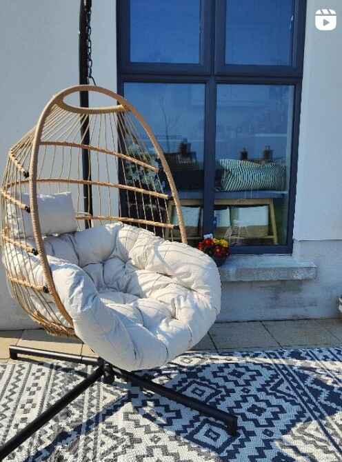 hanging egg chair on wooden deck