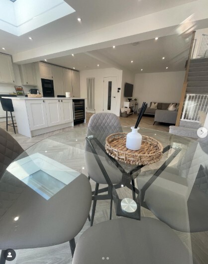 matching glass round dinign table with living room furniture