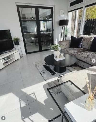 a modern living room in grey, white and black decor illustrating a perfect home design
