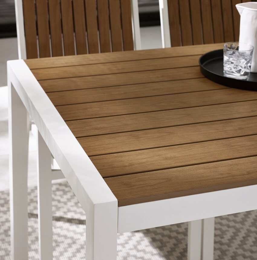 close up detail of a white metal and polywood garden tabletop