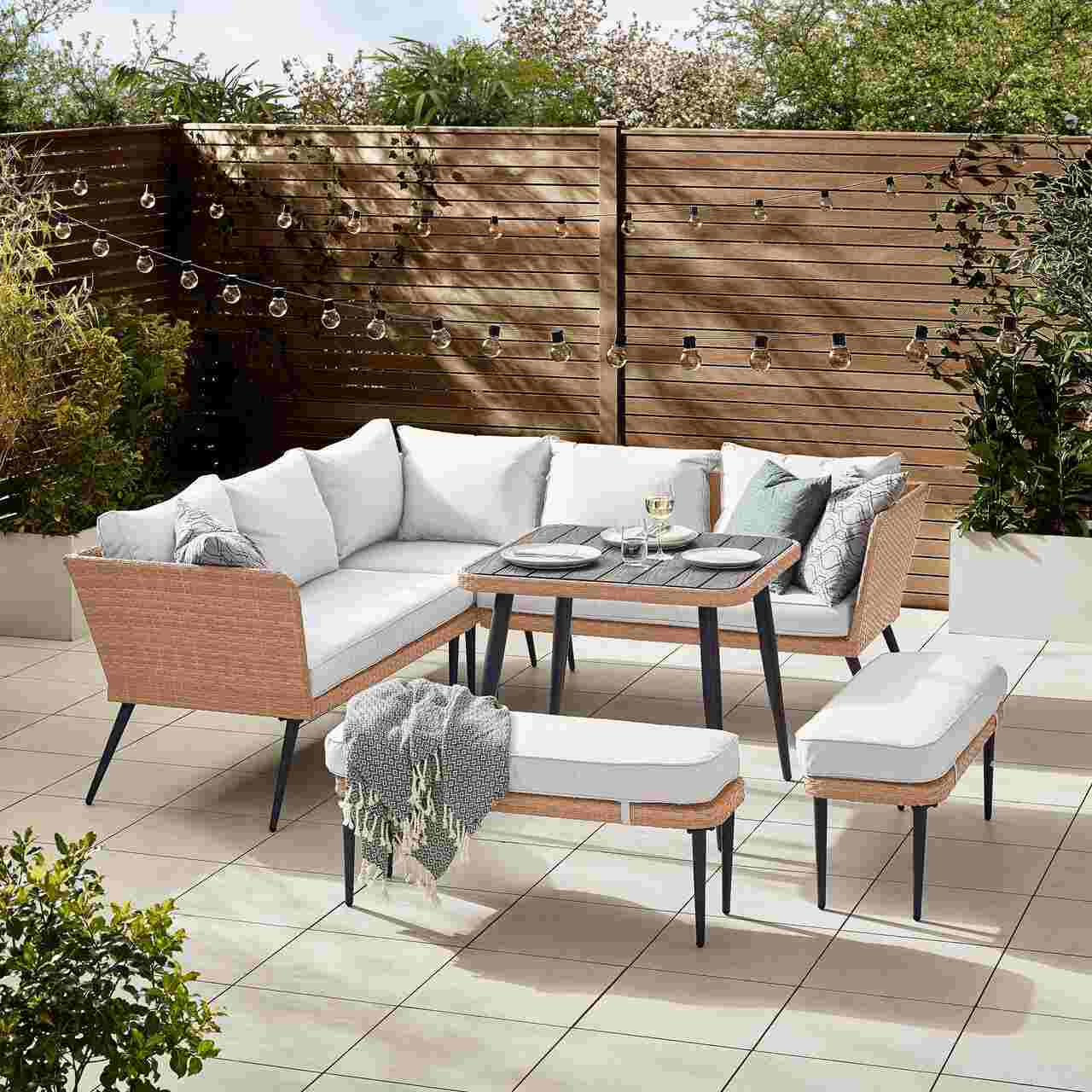beige rattan corner sofa with dining table