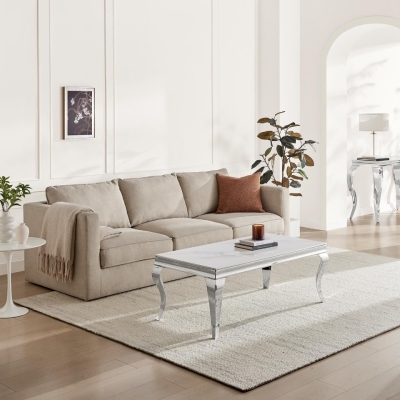 white marble effect rectangular coffee table in front of beige fabric sofa, on rug in modern living room