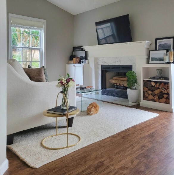 small living room layout idea with light fabric sofa, small side table and wall mounted tv