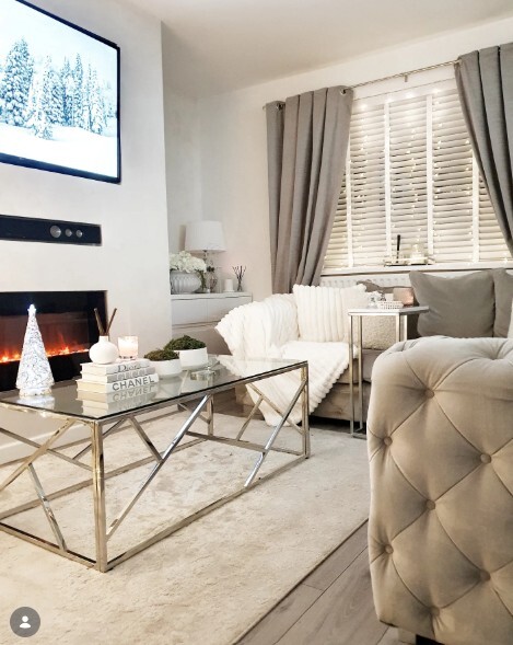 small living room layout with chrome coffee table grey sofa and wall mounted tv